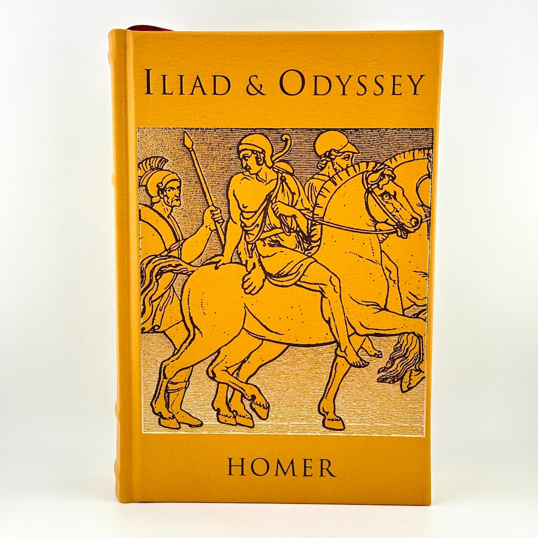 Book cover of 'Iliad & Odyssey' by Homer with illustrations of warriors on horses.