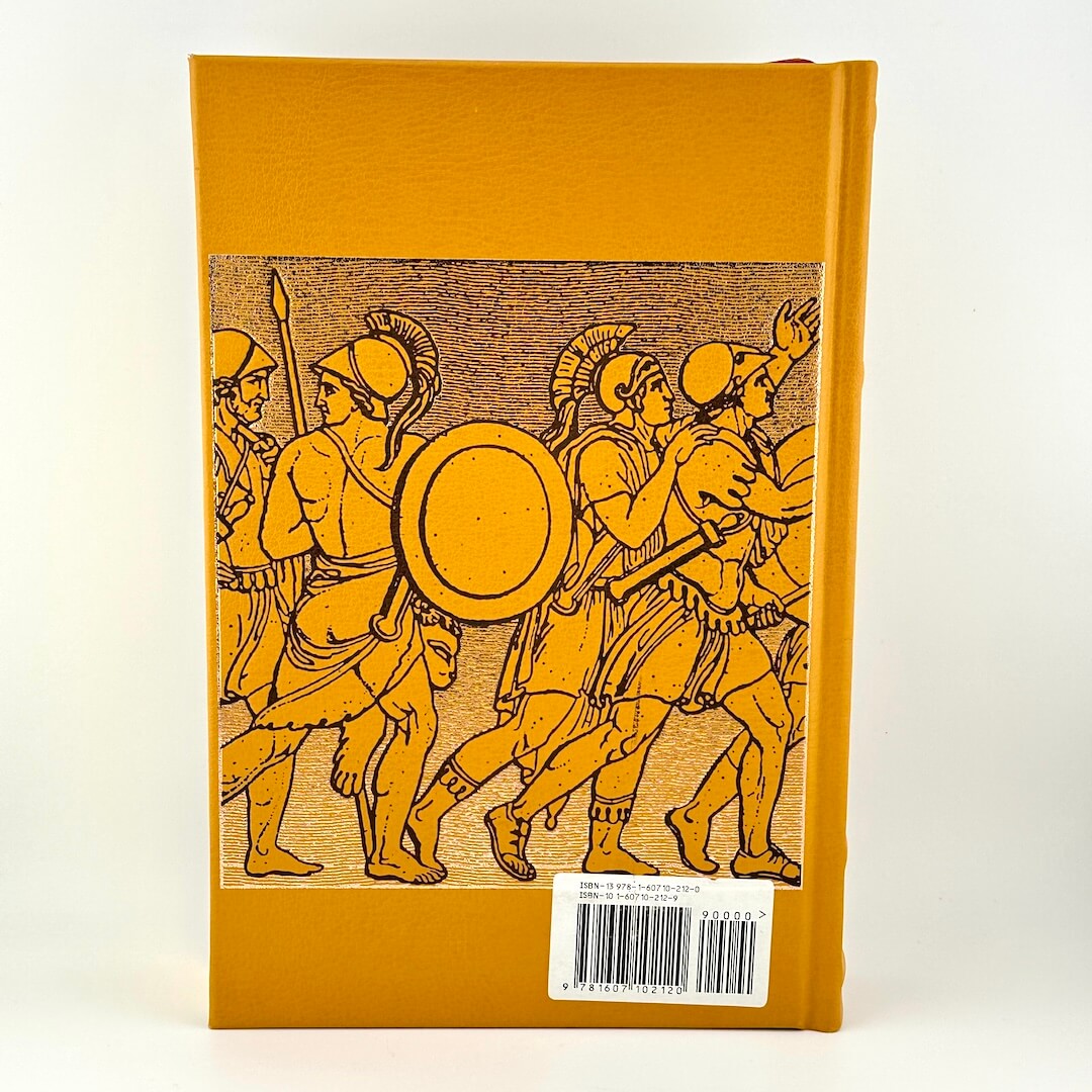 Book with illustration of ancient warriors on a mustard yellow background