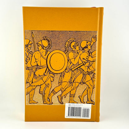 Book with illustration of ancient warriors on a mustard yellow background