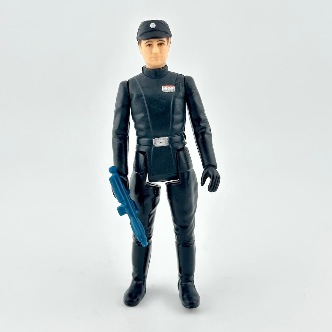 Action figure in black costume with blue weapon on a white background