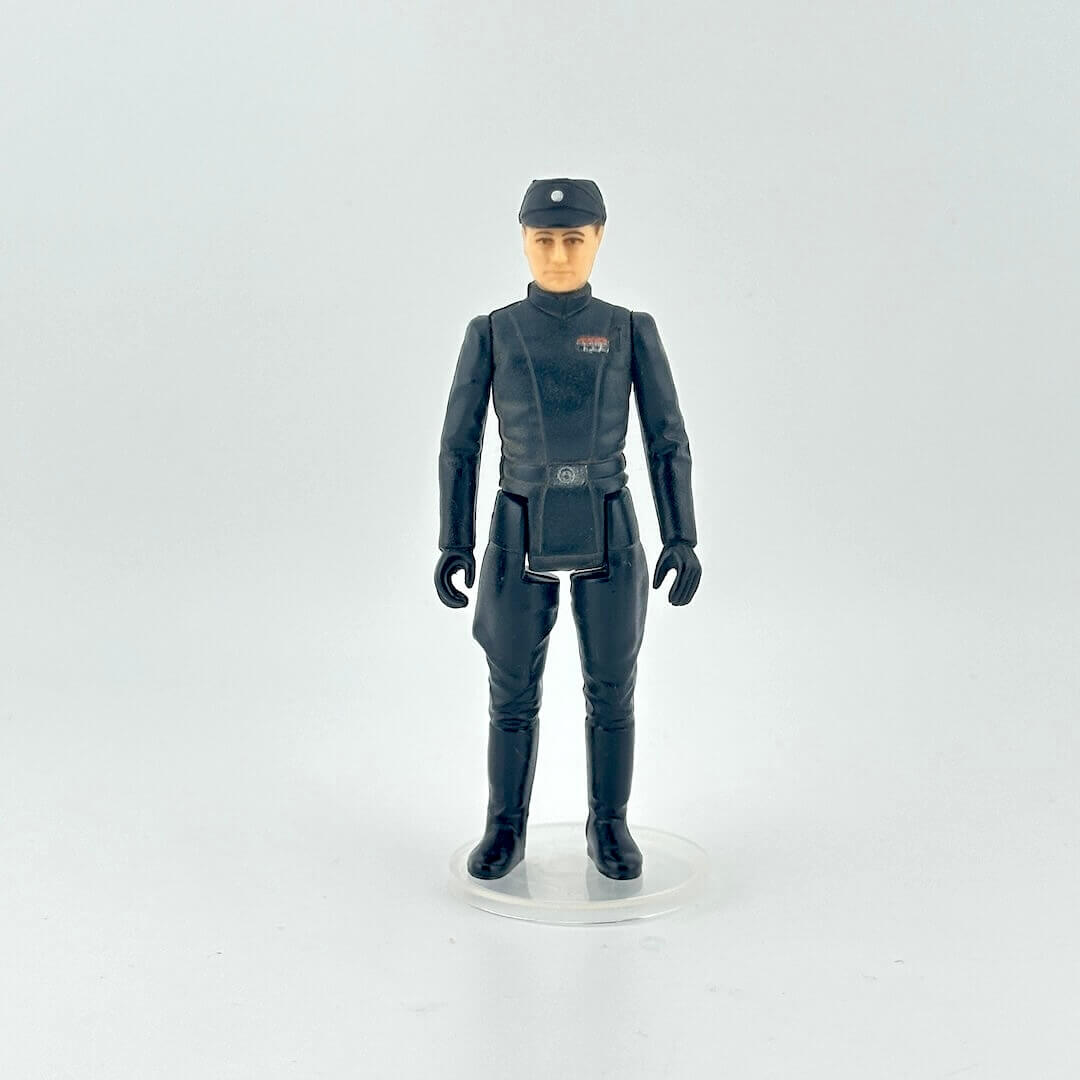 Action figure in a dark blue military uniform with a cap on a white background