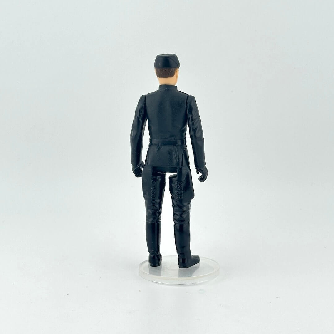 Action figure in a dark blue military uniform with a cap on a white background