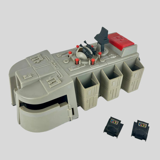 Toy space vehicle with several compartments and two separate black pieces.