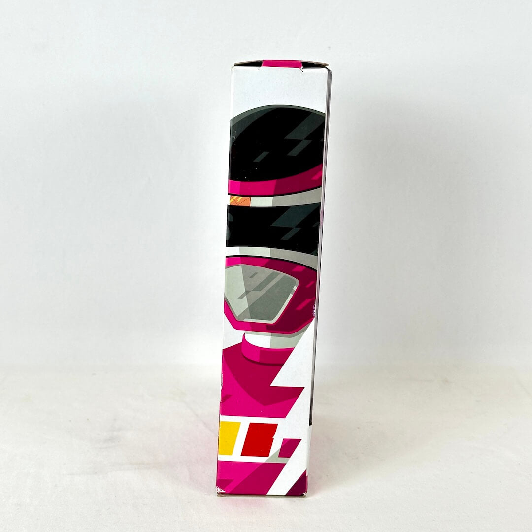 Side view of packaging with illustration of Pink Ranger, photographed on white background. 