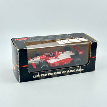 Model car in a box with a limited edition label on a gray background