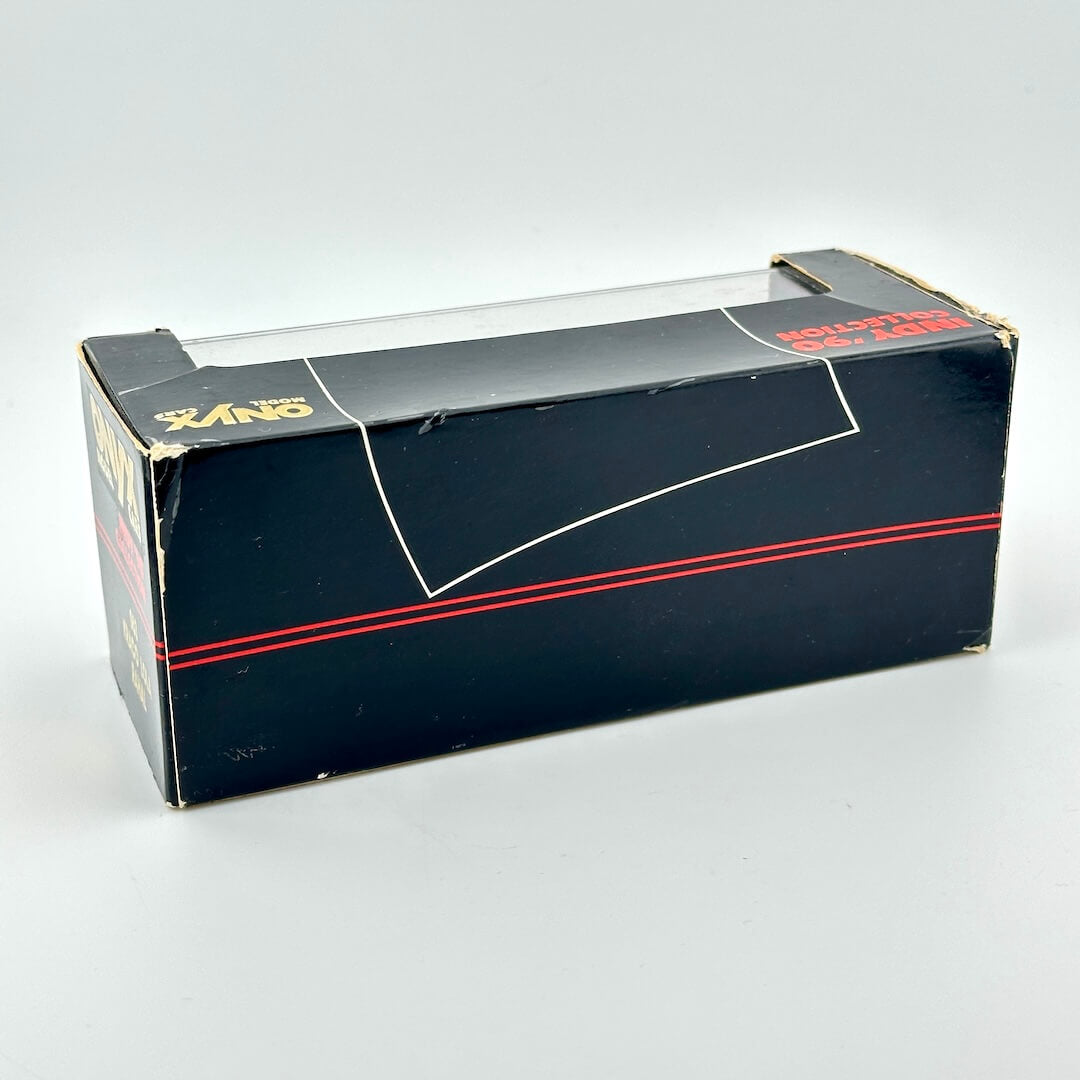 Black toy box with red stripe on a white background