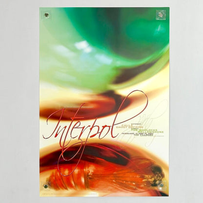 Poster with 'Interpol' text and abstract design on a gray background