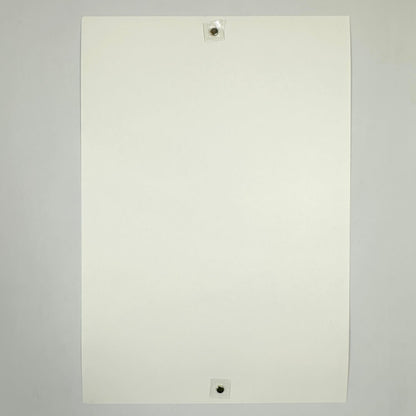 Backside of white poster to show pristine condition against white background. 