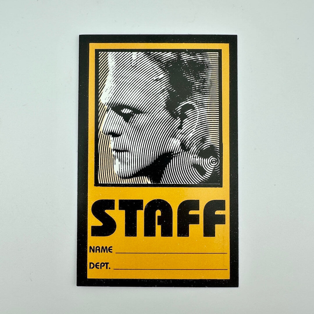 Staff ID card with a stylized Frankenstein portrait on a yellow background