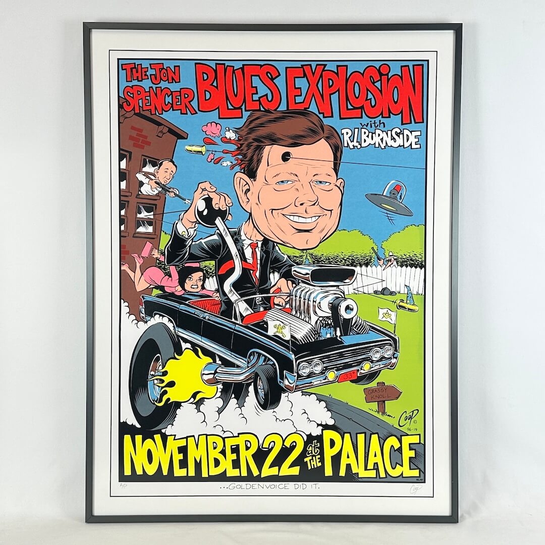 Framed poster of a caricatured figure on a motorcycle with event details.