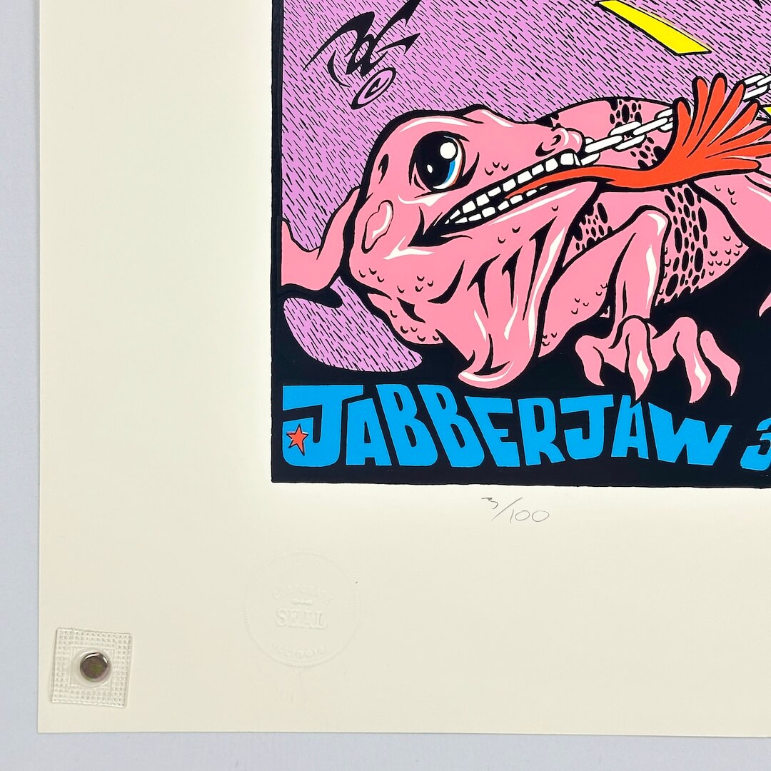 Bottom left corner of poster showing crisp edges and corner. Features artist embossed seal. 