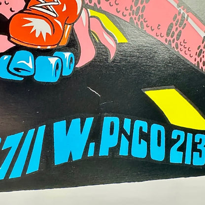 Close up of crease/dent to poster above venue address. 