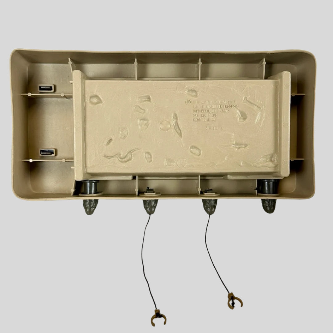 Underside of beige platform base with  embossed copyright information.