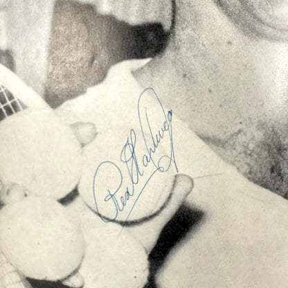 Close-up of a signature of Rex Hartwig on a black and white photo. 
