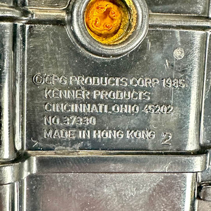 Close-up of copyright information embossed on plastic on undercarriage. 