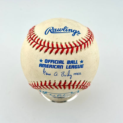 A Rawlings official American League baseball displayed on a clear stand against a light gray background.
