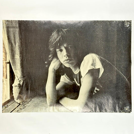 Vintage black and white poster of Mick Jagger sitting by a window