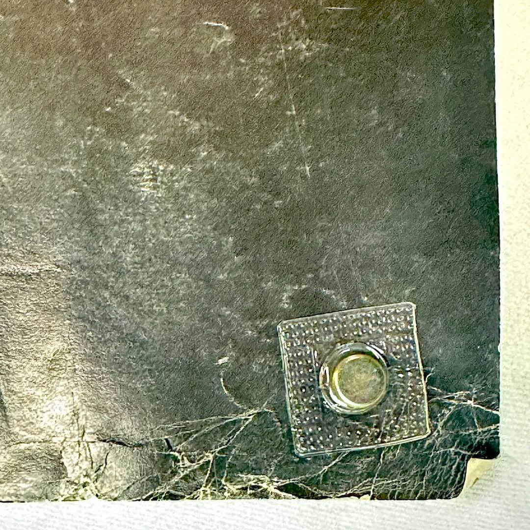 Bottom right corner, rolled, with creases and scratches. 