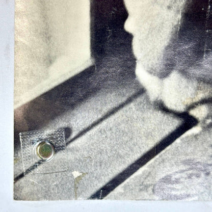 Bottom left corner of poster with adhesive scar and scratches to face. 