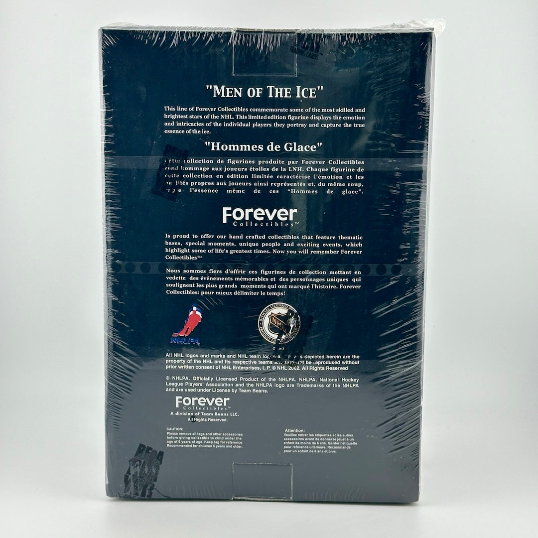 Black box with white text wrapped in plastic. 