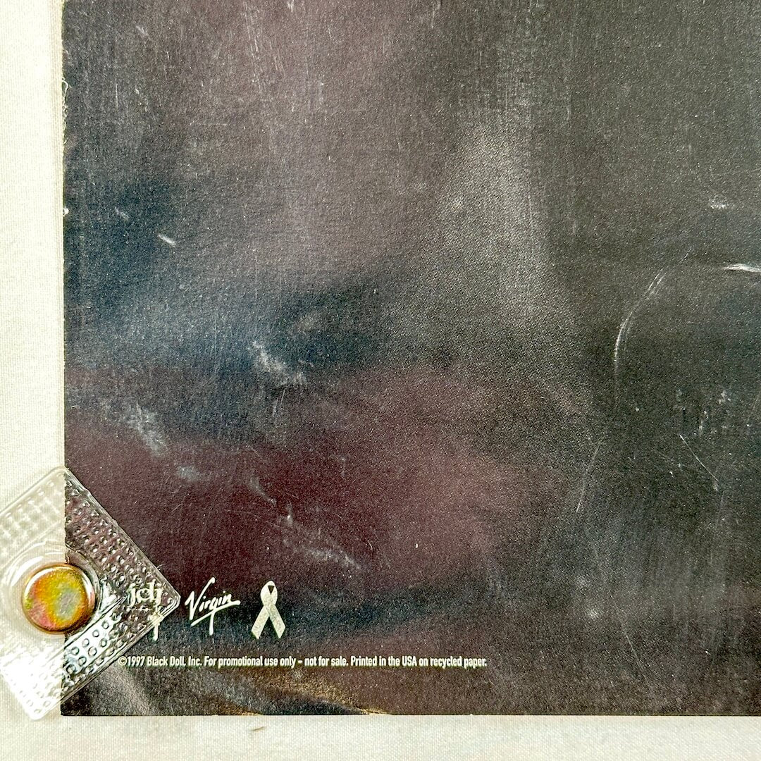 Bottom right corner of poster with licensing information and some edge wear. 