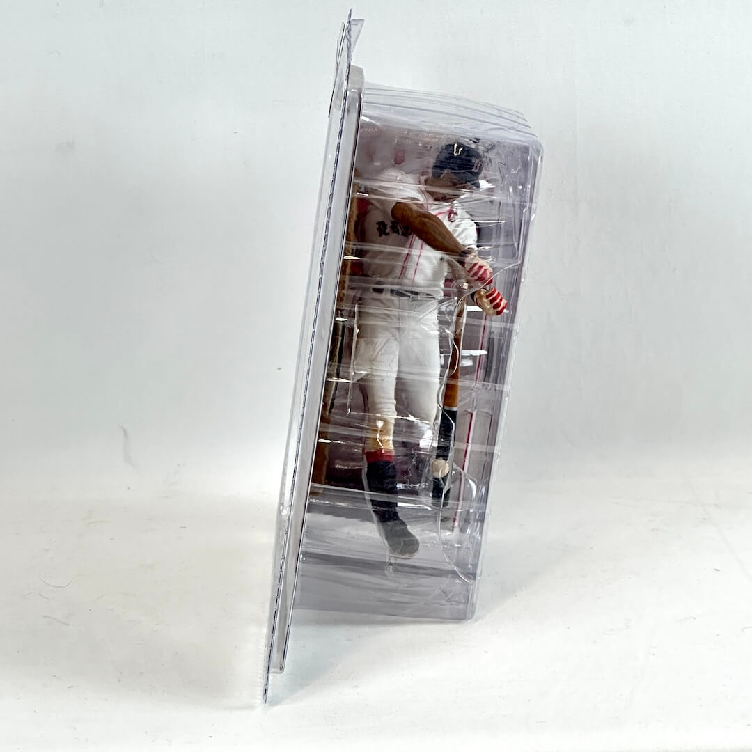 Baseball player figure in a clear packaging on a white background