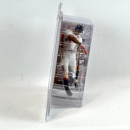 Baseball player figure in a clear packaging on a white background