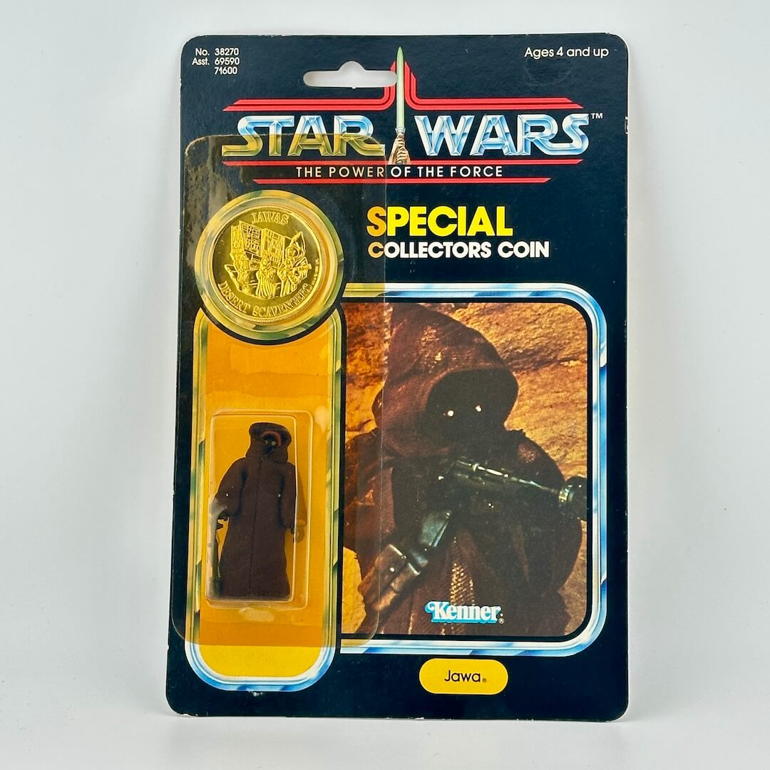 Star Wars Jawa collectible coin and figure in packaging with 'Kenner' branding