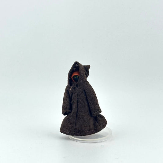Small figure of a character in a brown robe on a white background