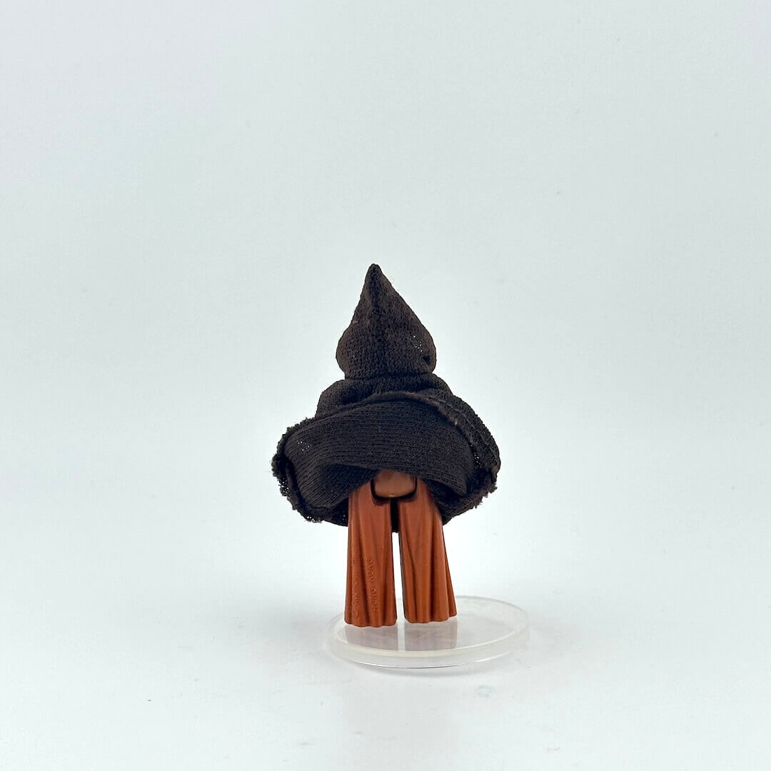 Brown robed action figure on a white background