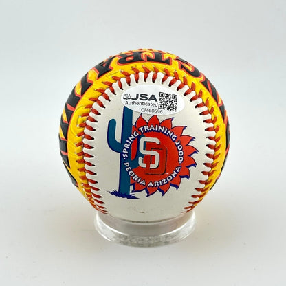 Colorful baseball with branding and certification logo on a white background