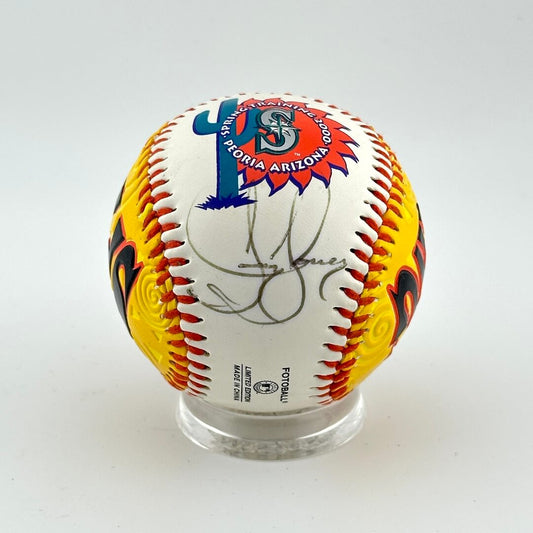 Baseball with colorful design and signature on a white background