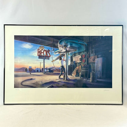 Framed artwork of a person playing guitar in front of a guitar shop sign.