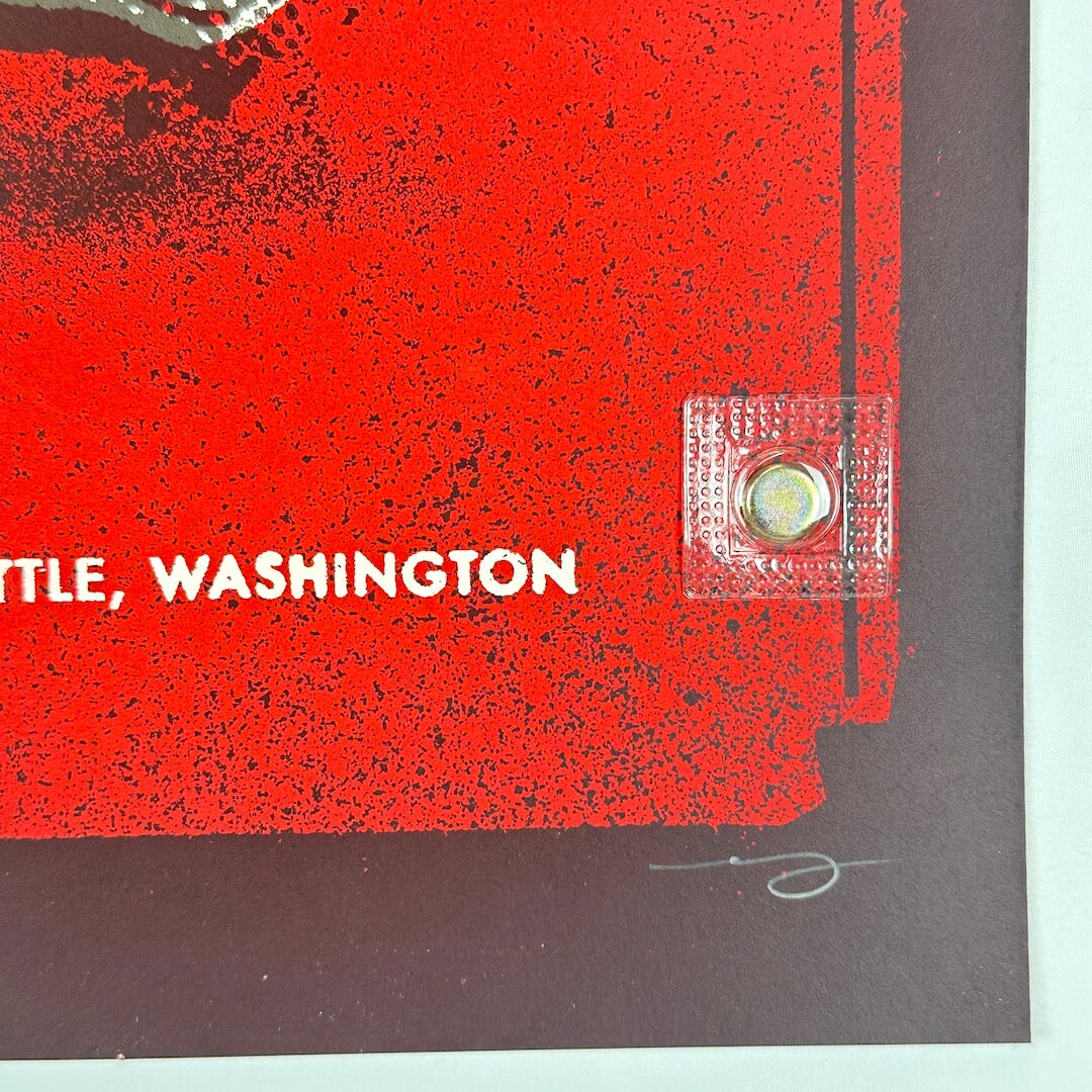 Bottom right corner showing no damage to corner or edges of poster. Artist signature in pencil in border.