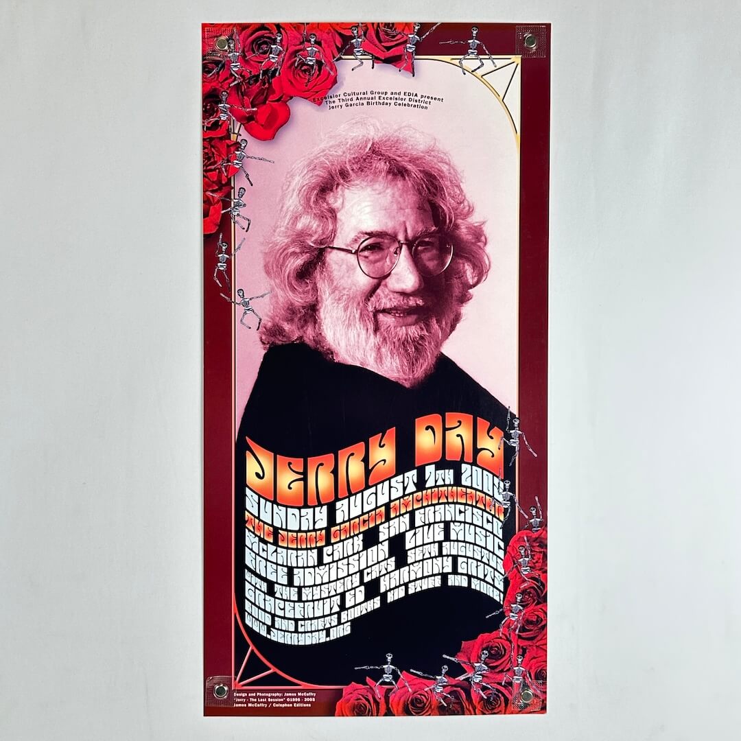 A vertical poster featuring a portrait of Jerry Garcia with red roses, and bold orange text listing concert details. 