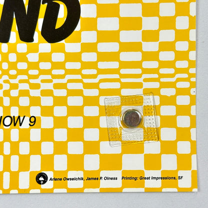 Yellow and white checkered pattern with text and a clear square object on a gray background