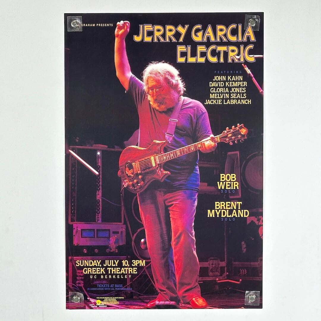 Poster of Jerry Garcia Electric concert featuring a musician on stage with instruments.