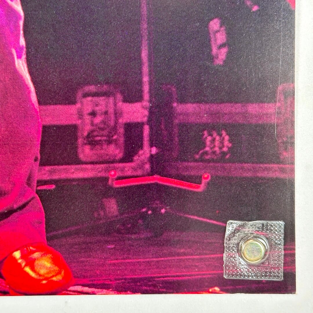 Bottom right corner with light scratches to poster. 