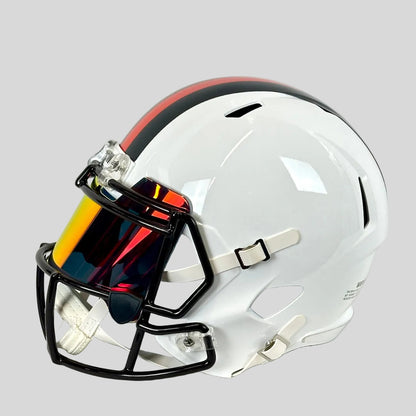 Side view of white football helmet with mirrored face shield. 