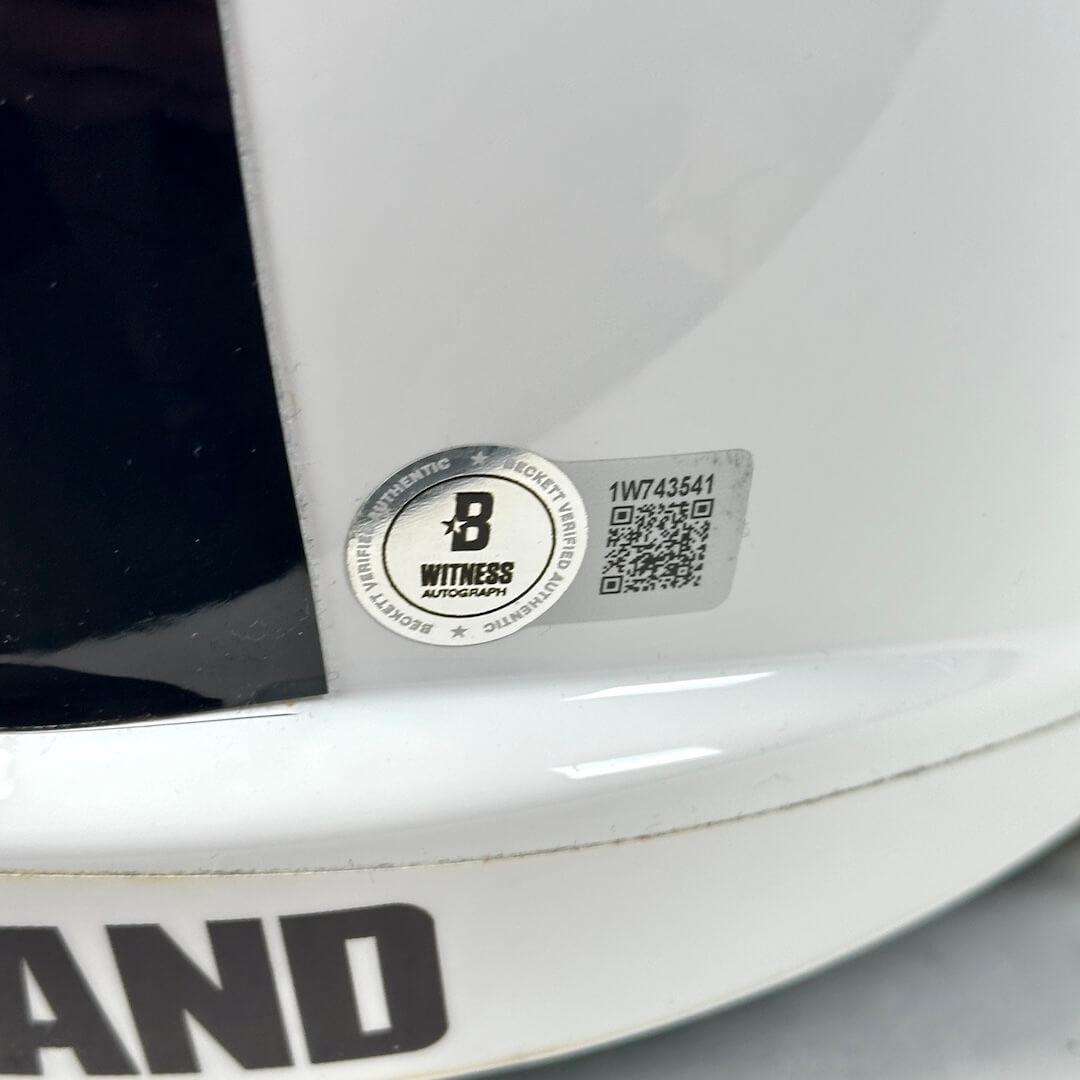 Close-up of authentication sticker with QR code and serial number. 