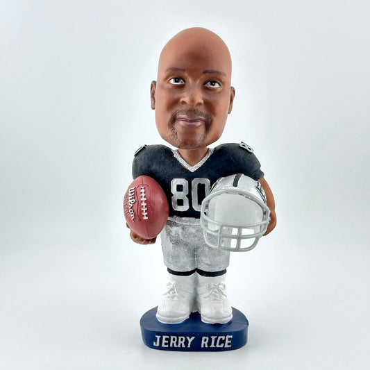 Bobblehead of a football player holding a helmet and ball on a white background