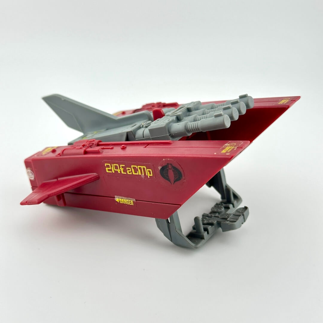Red and gray toy vehicle on a white background