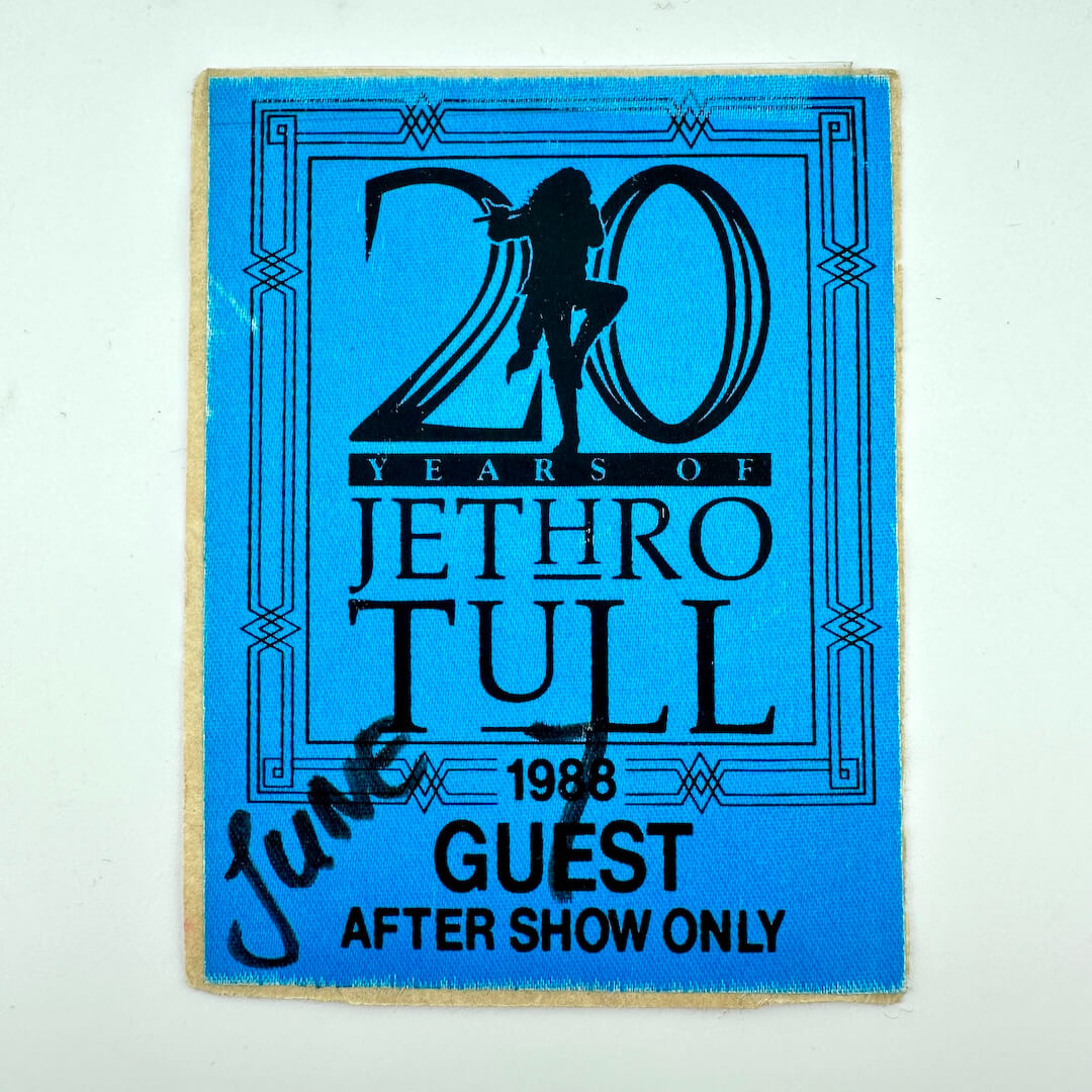 Blue fabric event pass with black text and graphics.