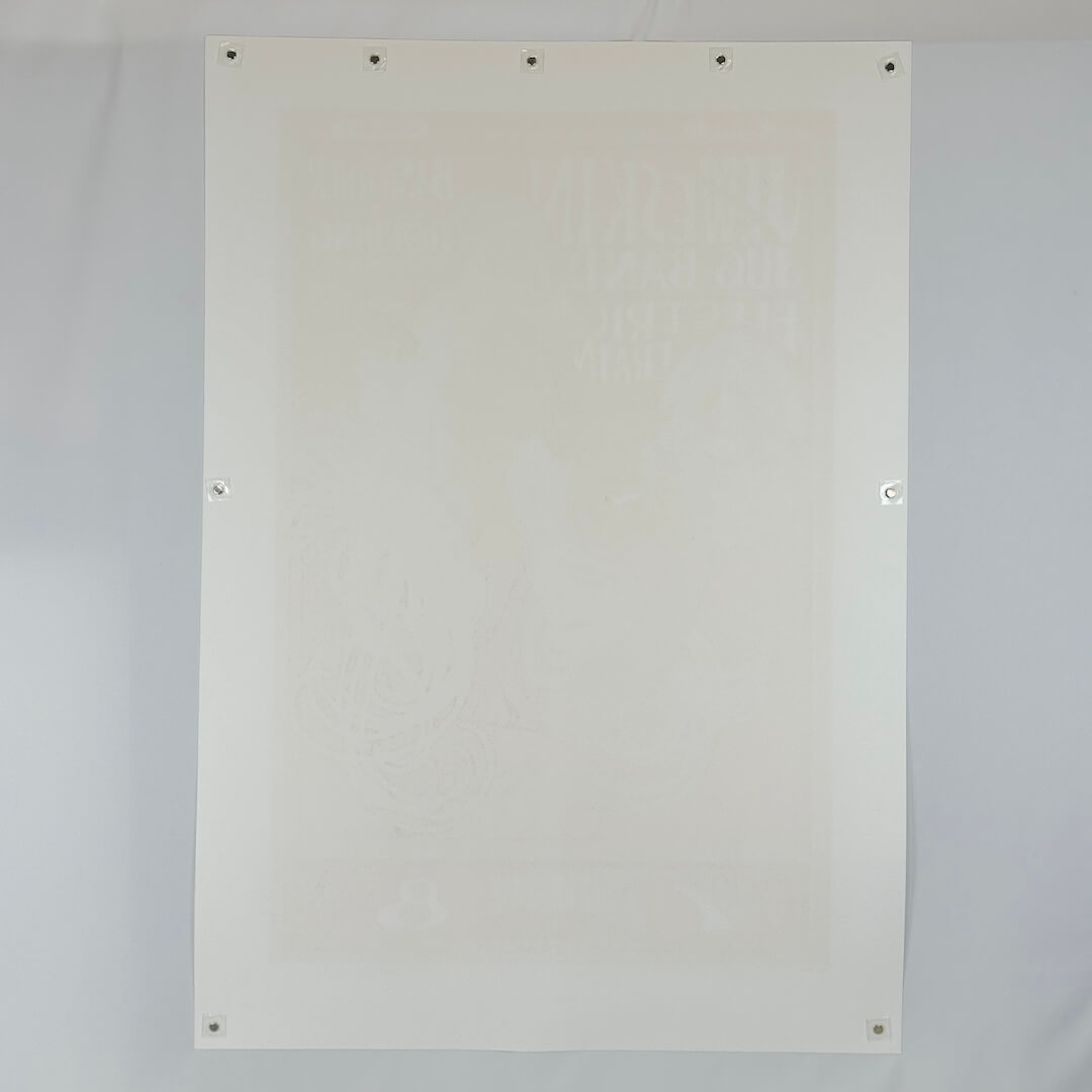 Backside of white poster to show zero damage and pristine condition against white background. 