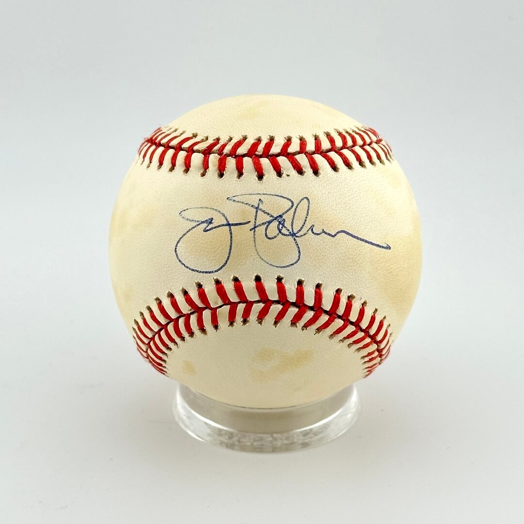 Baseball with autograph on a white background