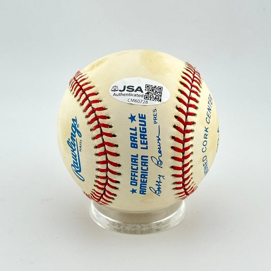 Baseball with Rawlings logo and JSA authentication on a white background