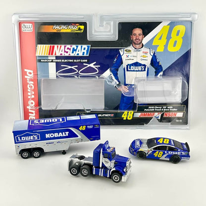 Slot cars and packaging against white background. 