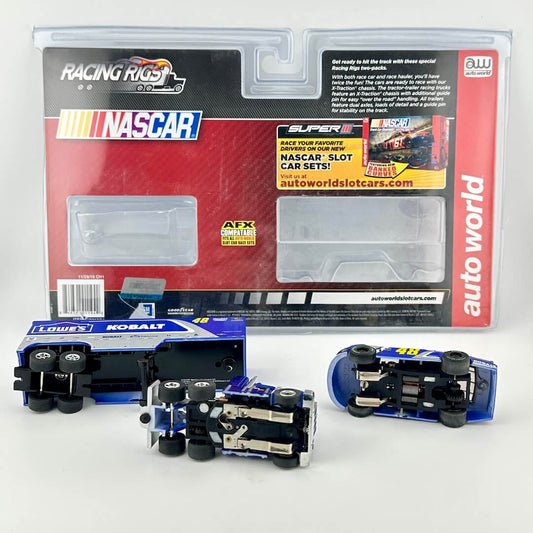 Toy slot cars with packaging against white background. 