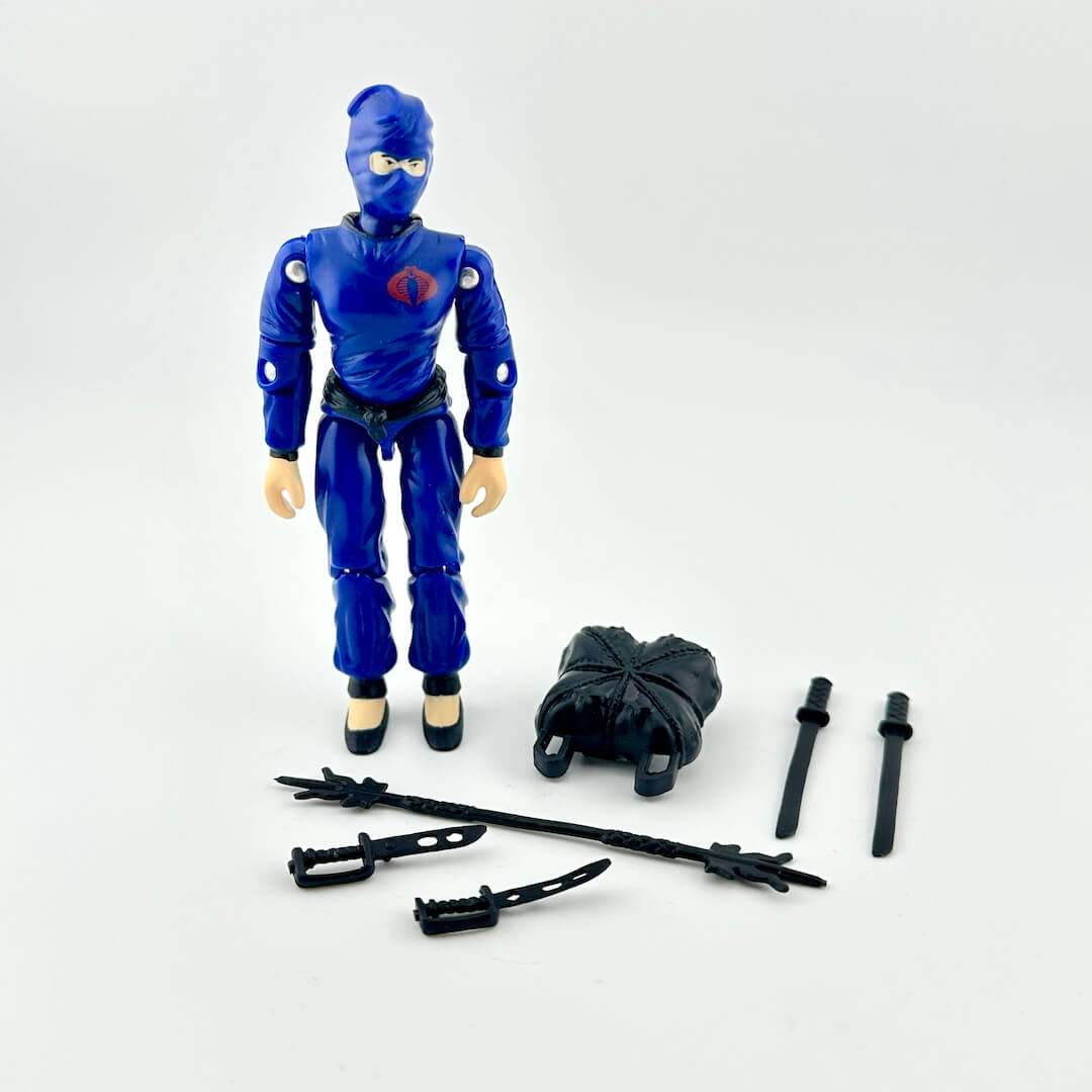 Blue action figure with accessories on a white background