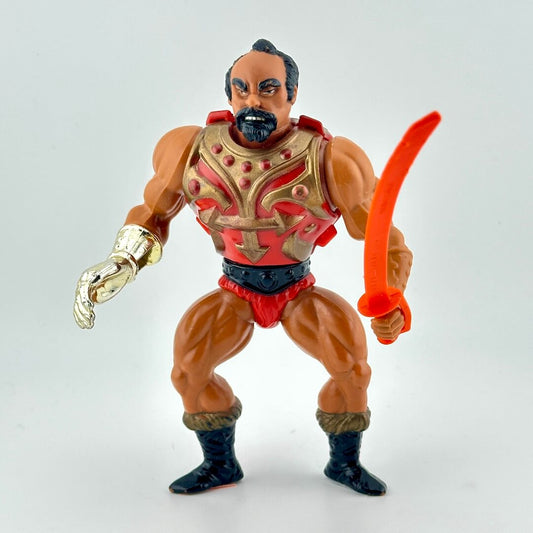 Action figure with a red and gold costume holding an orange sword on a white background